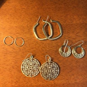 Assorted earrings all gold colored.